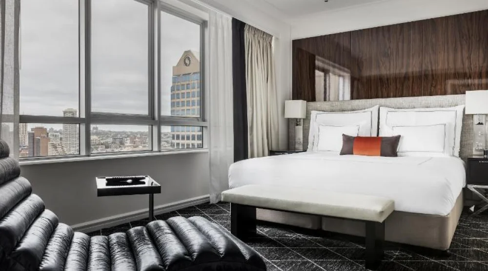 Executive Suite One King Bed Separate Living Room with Sofa Dining Area Club Floor Accessible at Swissotel Sydney