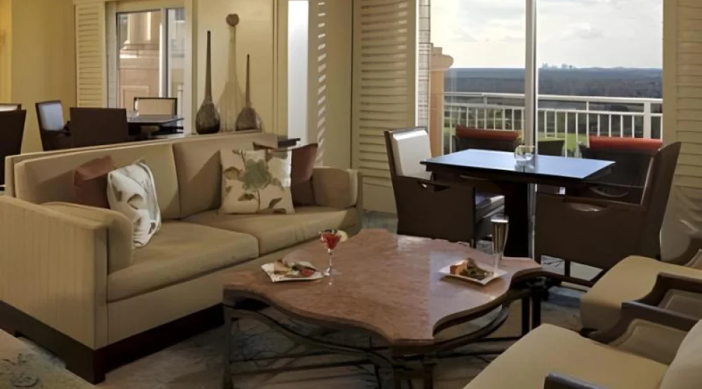 Club Level, One Bedroom Executive Suite, One King, Sofa Bed, Lakefront View, Pool View at The Ritz-Carlton Orlando Grande Lakes