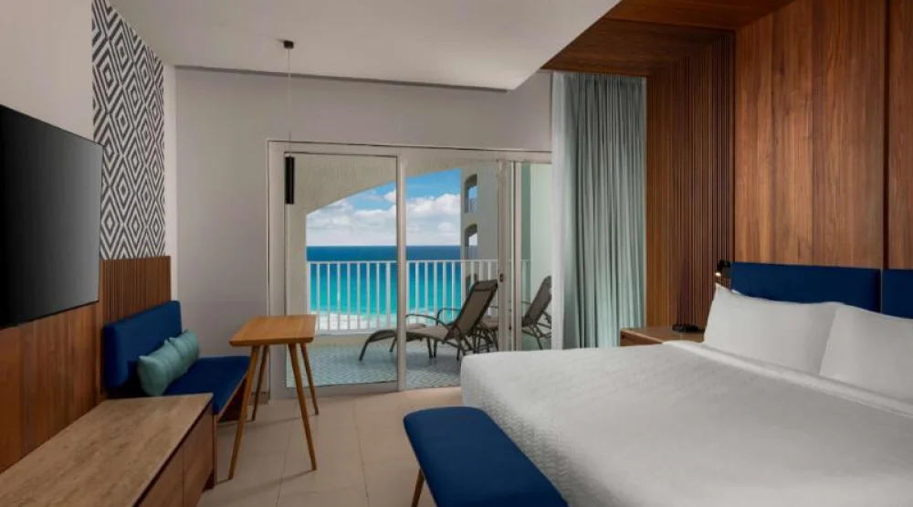 Deluxe Ocean View One King Bed Room-balcony at Hilton Cancun Mar Caribe All-Inclusive Resort