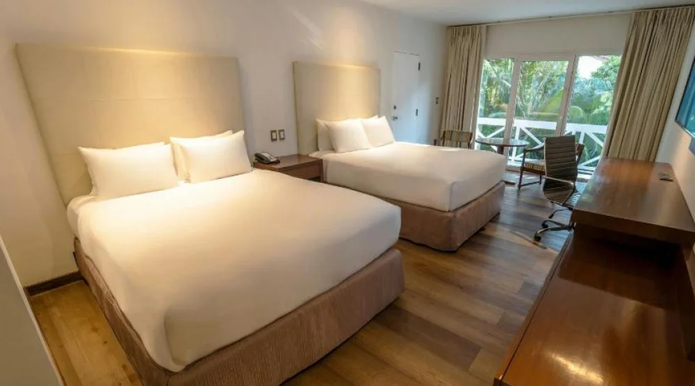 Executive Queen Room with Two Queen Beds, Balcony and Garden View at Los Tajibos a Tribute Portfolio Hotel