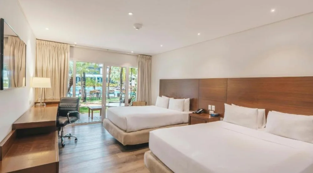 Poolside Queen Room with Two Queen Beds at Los Tajibos a Tribute Portfolio Hotel