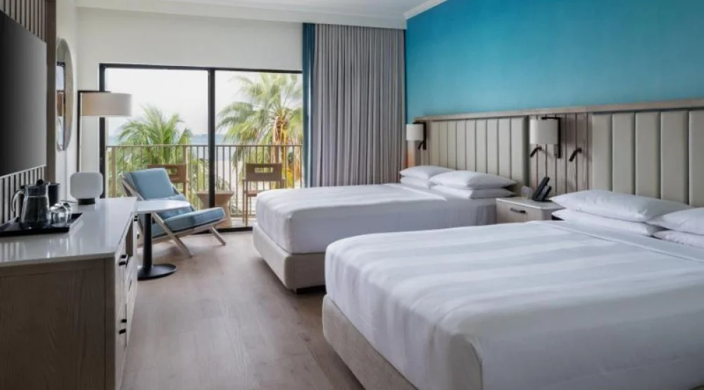 Partial Oceanview King, Guest Room, One King, Sofa Bed, Partial Ocean View, Balcony at Grand Cayman Marriott Resort