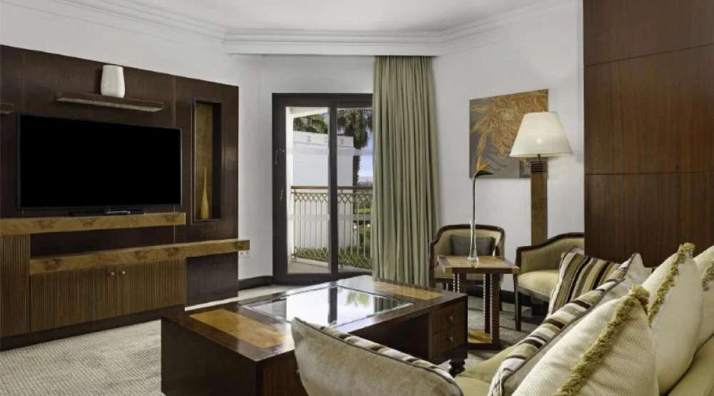 Junior Suite King Bed Room / Living Room at Hilton Luxor Resort & Spa