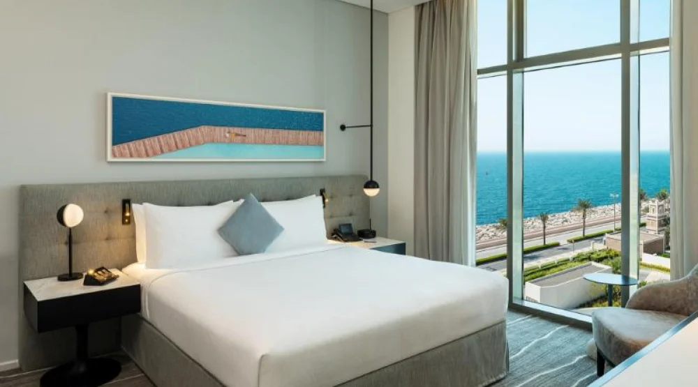 One Bedroom Suite Dining Kitchen Balcony Arabian Sea View at Th8 Palm Dubai Beach Resort Vignette Collection