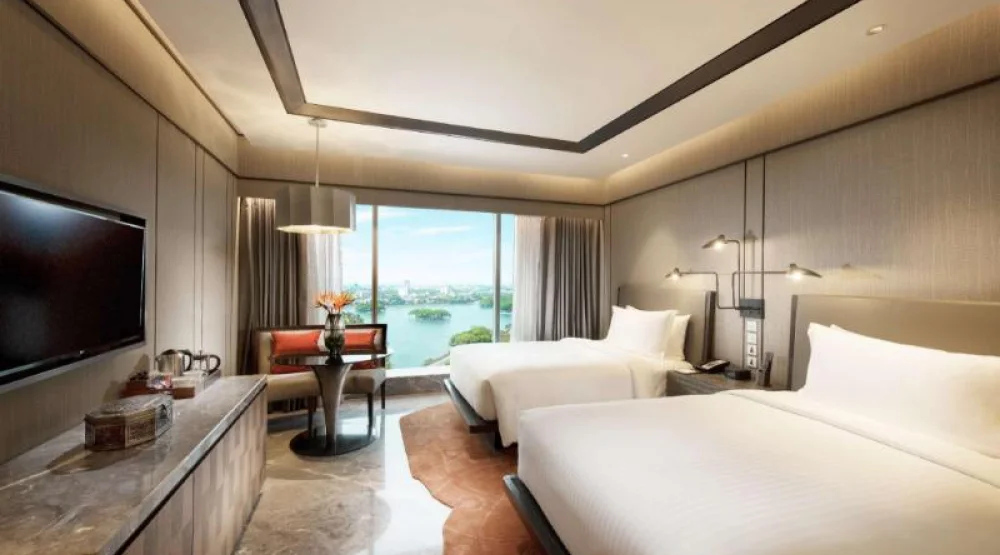 Two Twin Deluxe High Floor Lake View Room at Conrad Bengaluru