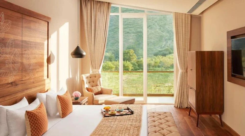 Deluxe Room with Garden and Sit-out King Bed at Taj Aravali Resort & Spa