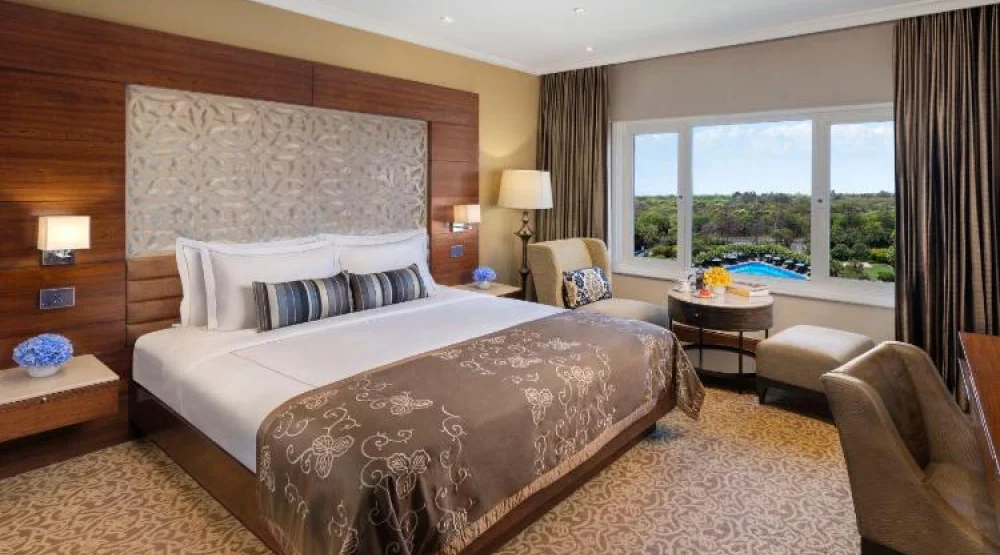 Taj Club Room King Bed Forest and Pool View at Taj Palace New Delhi