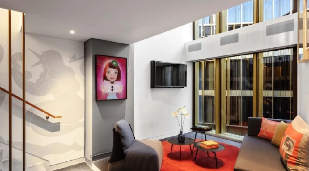 Supreme Suite Exchange, One Bedroom Bi-level Suite, in Loft: One King, Atrium View at W Amsterdam