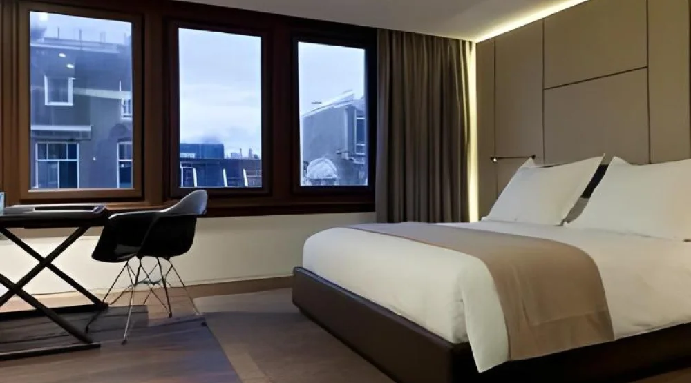 Deluxe Guest Room at Conservatorium Hotel
