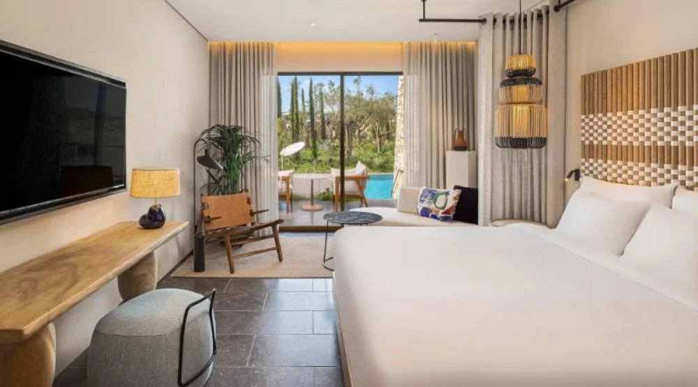 Fabulous Infinity Swim Up, Guest Room, One King, Garden View, Pool, Terrace at W Costa Navarino