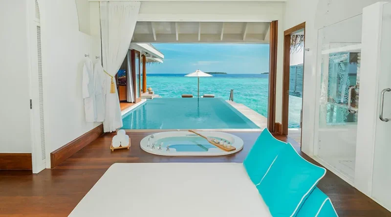 Sunset Over Water Pool Villa at Anantara Kihavah Maldives Villas